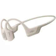 Shokz OpenRun PRO Bluetooth-Kopfhörer vor den Ohren, beige